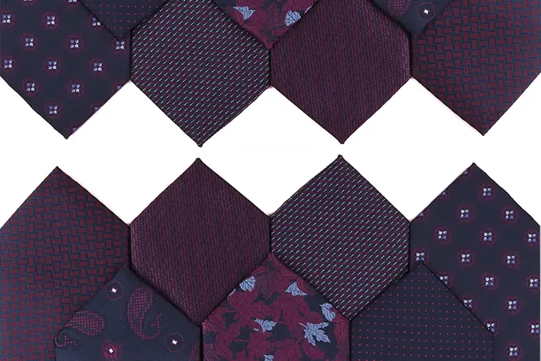 Dark neckties with different colors and small repeating patterns.
