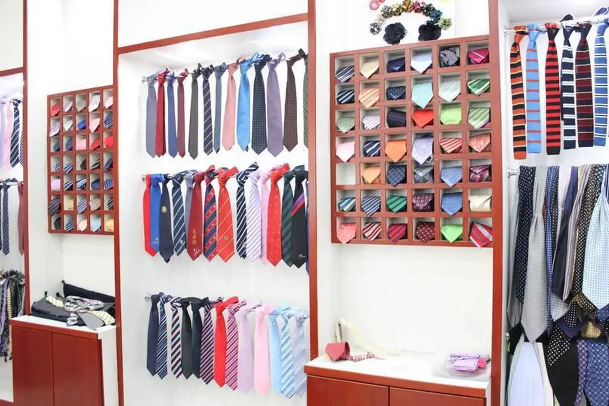 Tie and pocket square samples displayed in a showroom