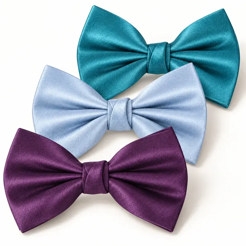 Teal, pale blue and purple silk bow ties with a refined satin sheen.
