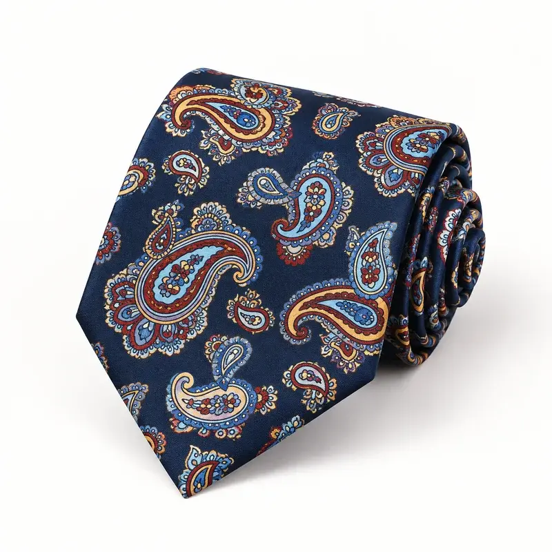 Rolled navy printed silk tie with multicolor paisley motifs.