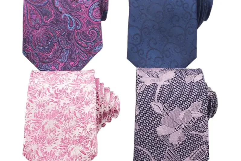 Pink, purple and blue neckties with floral and paisley patterns.
