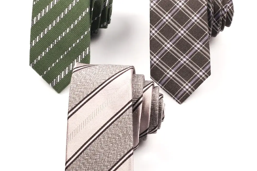 Green striped, brown checked and cream striped neckties.
