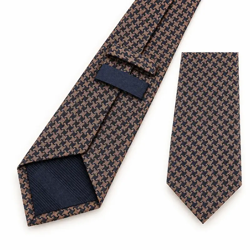 Brown and navy micro-geometric woven tie with dark tipping and a blank label.