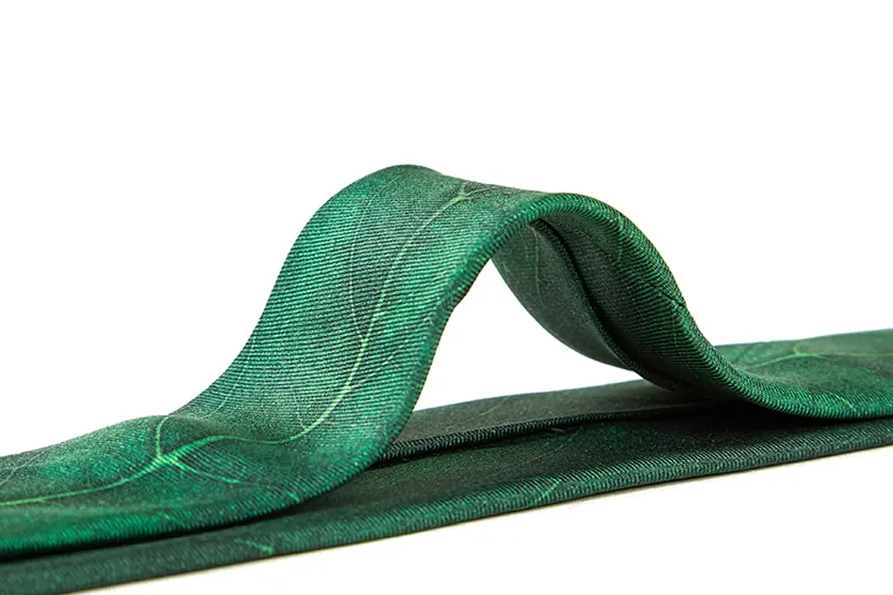 Green necktie reverse showing the center seam and keeper loop.