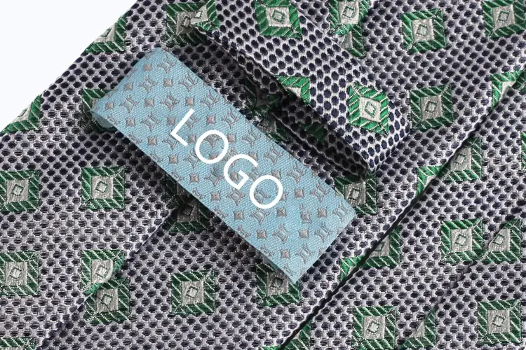 Light blue label marked LOGO sewn onto a patterned necktie.