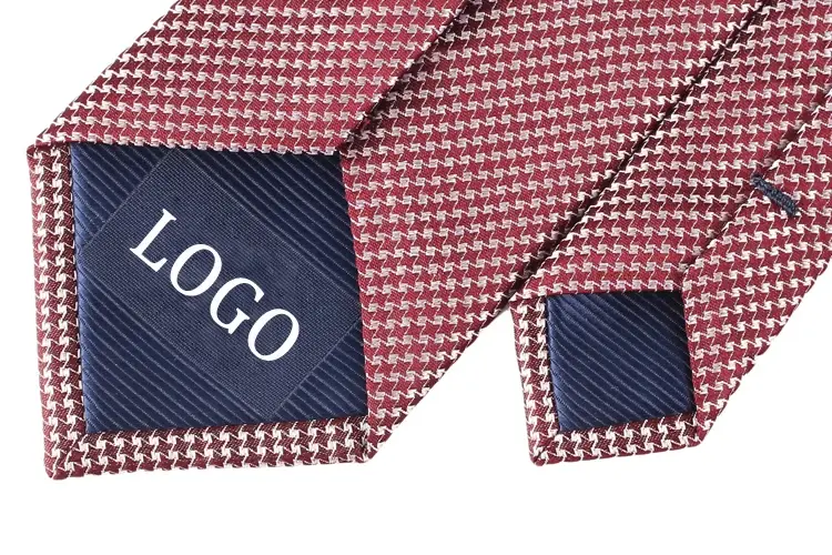 Red patterned tie ends with navy tipping marked LOGO.