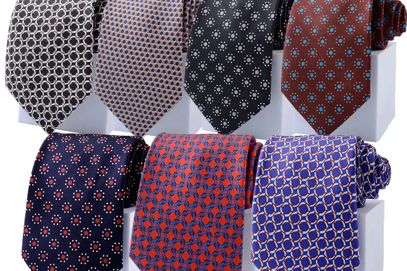 Patterned neckties arranged in two rows.