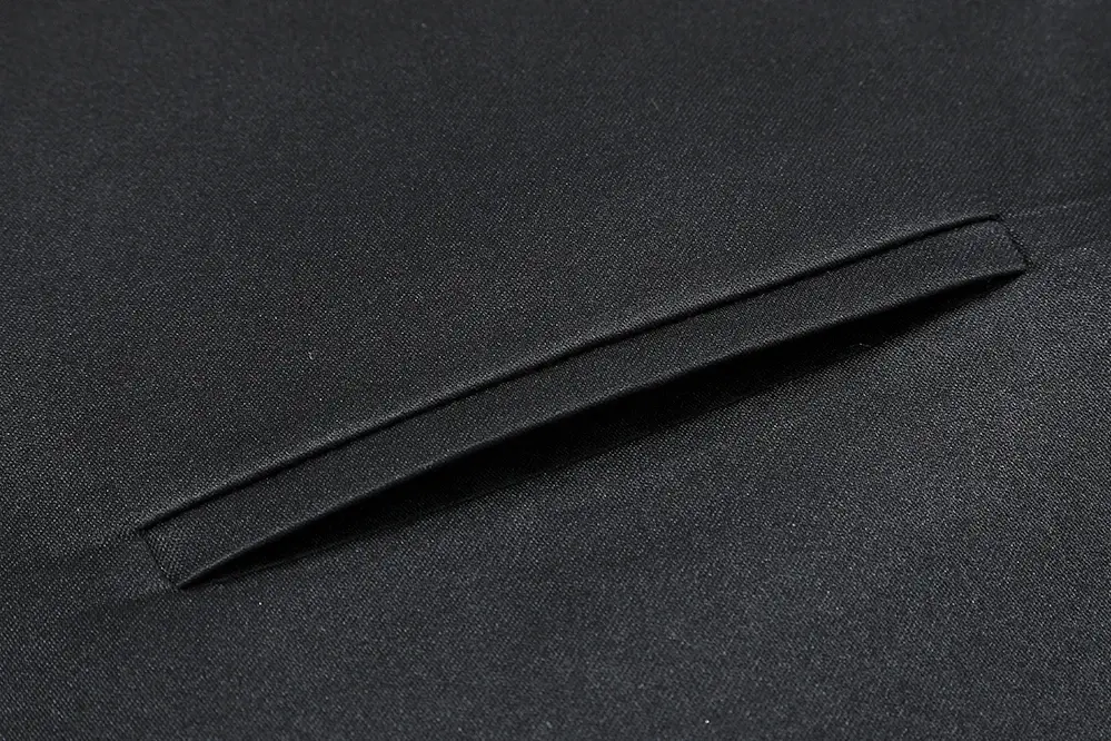Close-up of the back seam on dark tie fabric