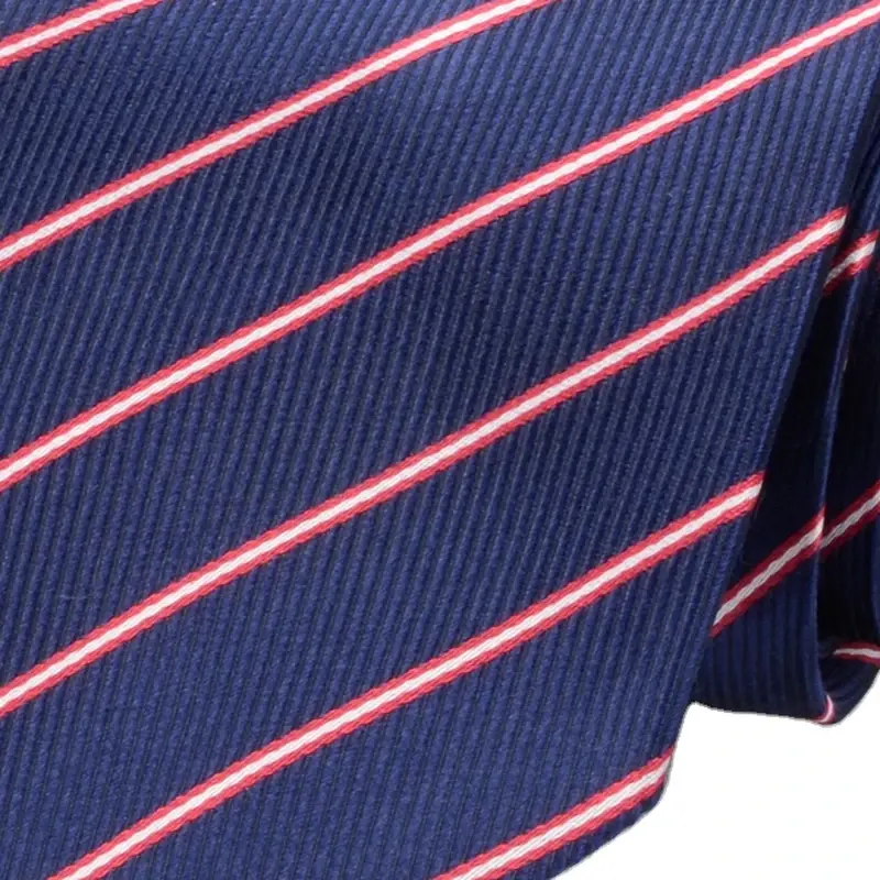 Close-up of navy necktie with diagonal pink stripes