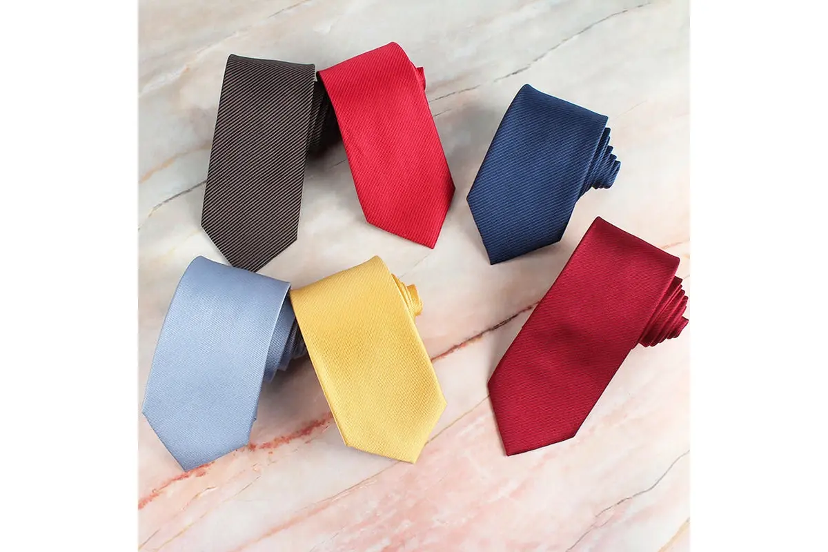 Six plain ties in gray, red, navy, pale blue, yellow and burgundy.