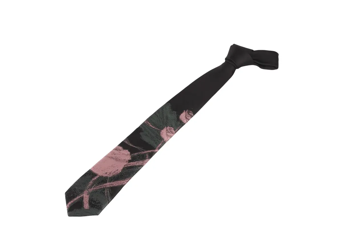 Full black knotted tie with a rose illustration positioned along the blade.