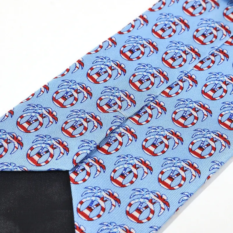 Light blue tie reverse showing repeated multicolor circular logos.