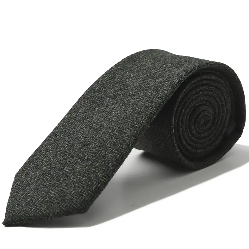 Rolled charcoal tie with a fine textured surface.
