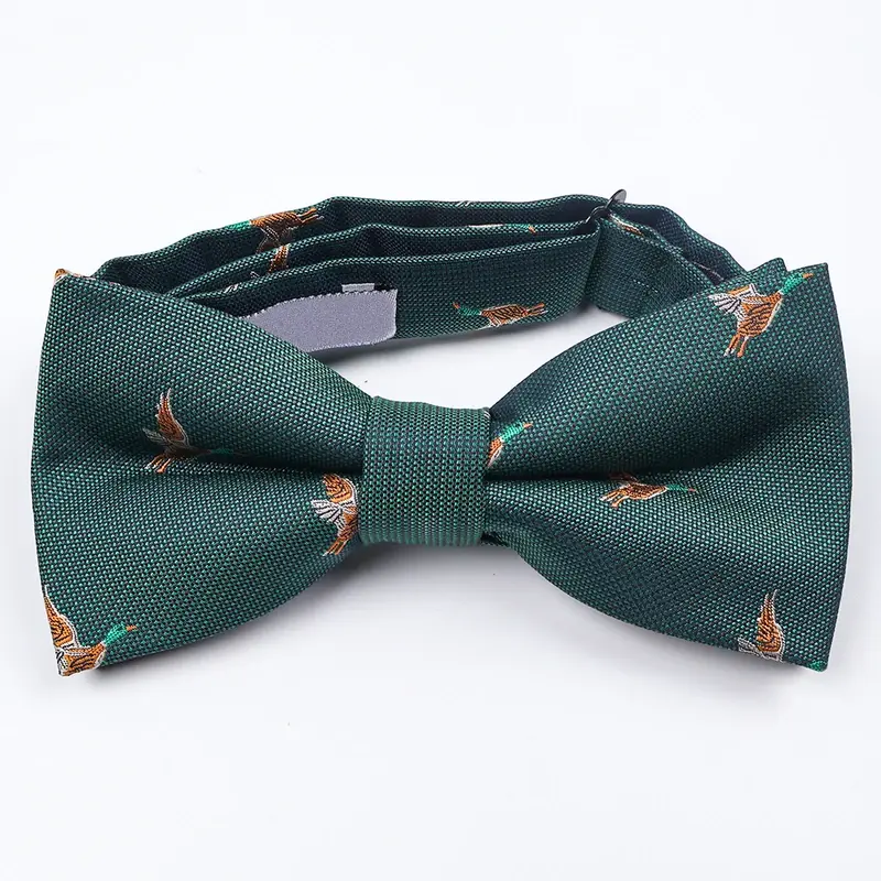Green bow tie with small bird motifs