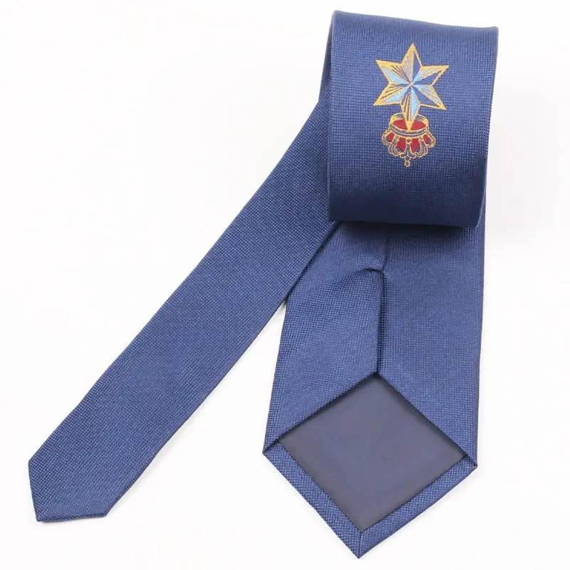 Blue tie with a placed crest and its reverse tipping visible.
