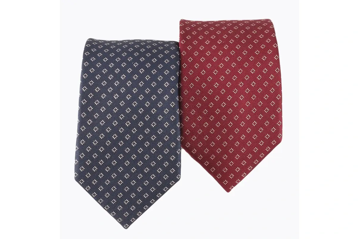 Grey and burgundy ties showing the same small repeating geometric motif.