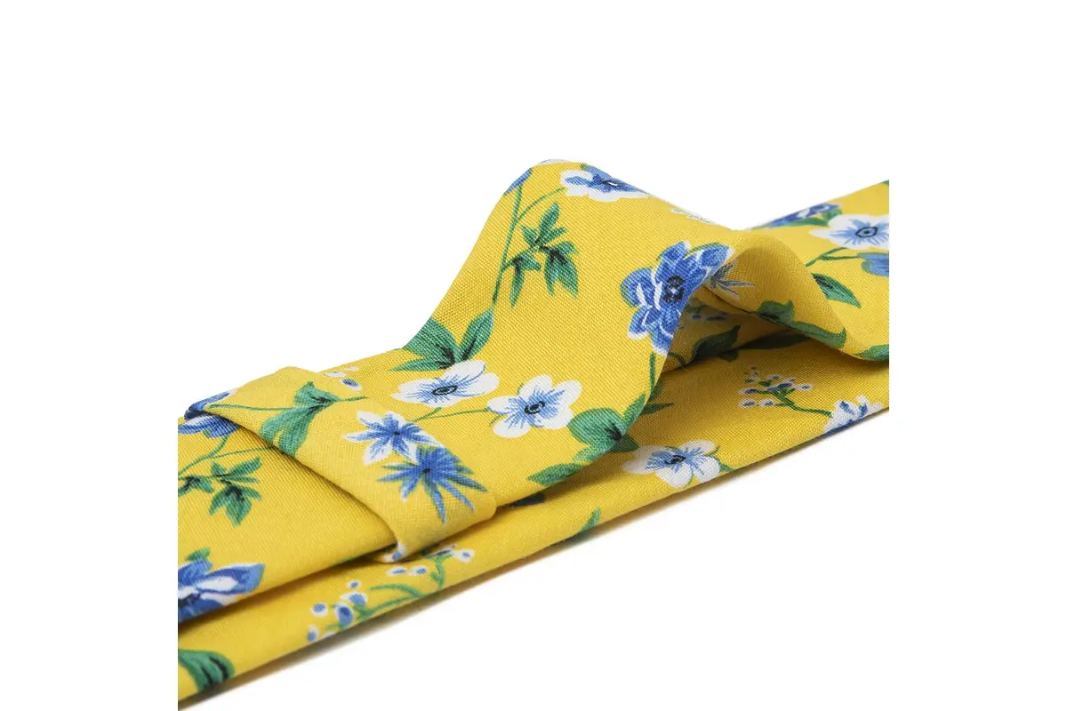 Yellow tie with blue and white flowers continuing across the blade fold.