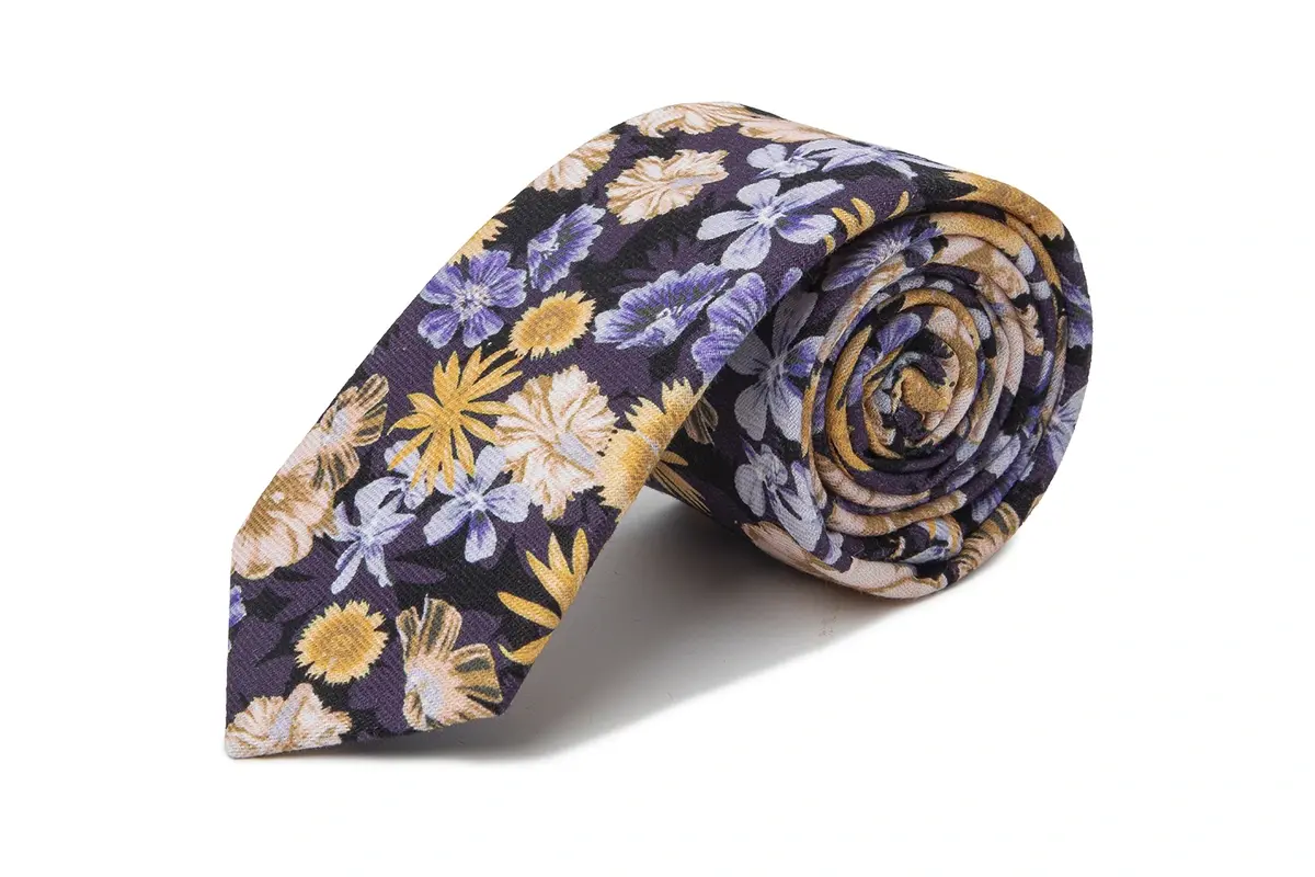 Rolled dark tie with a dense repeat of yellow and lavender flowers.