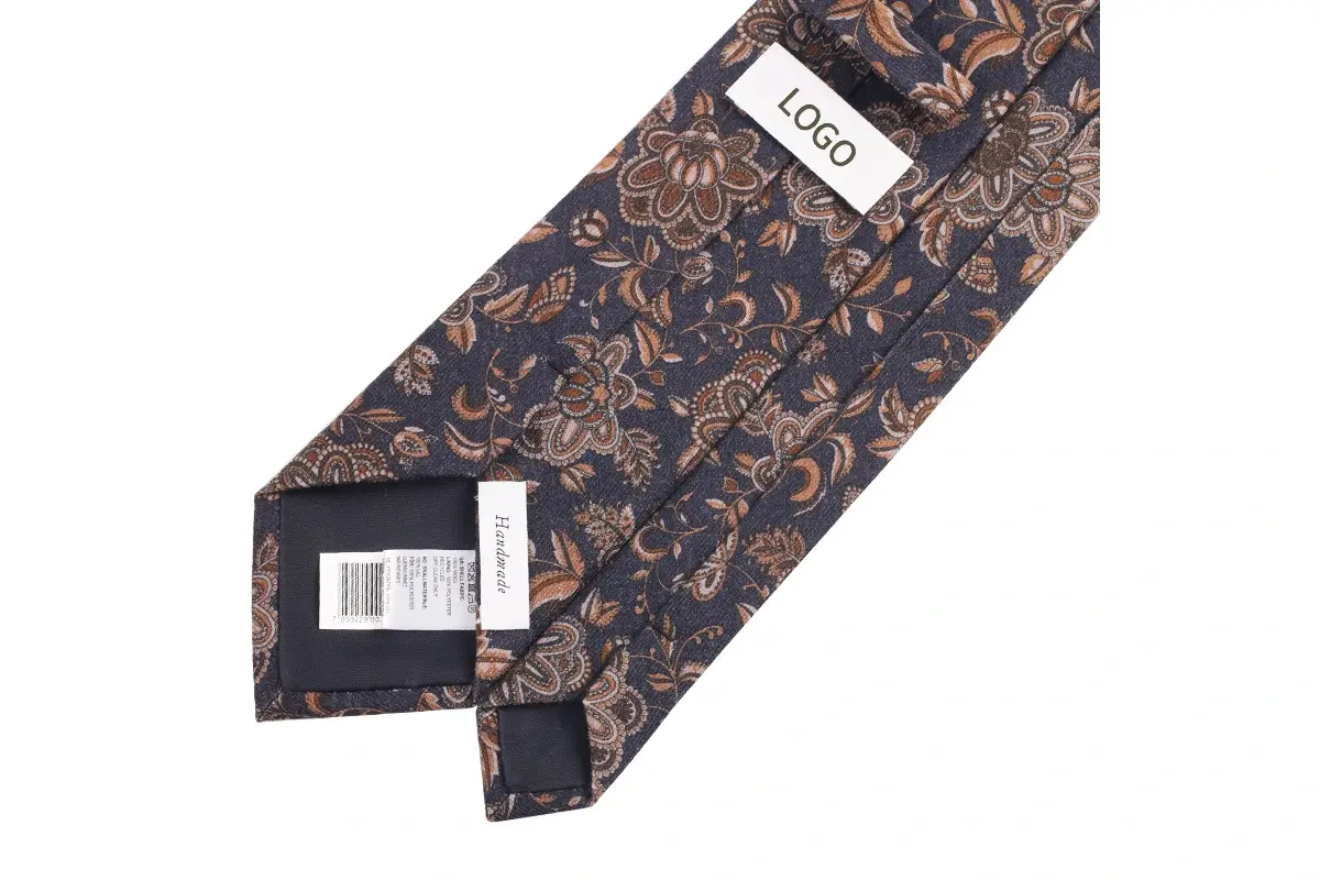Brown floral tie reverse with label, small white label and barcode hang tag.