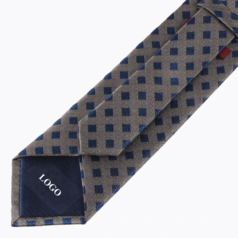 Geometric patterned tie reverse with dark tipping marked LOGO.