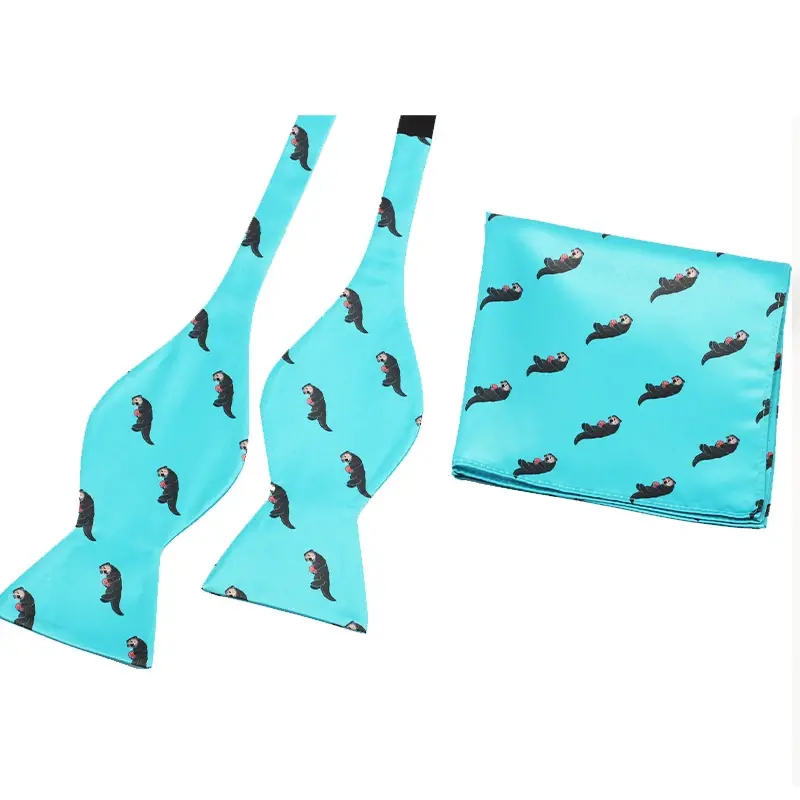 Turquoise self-tie bow tie and matching pocket square with small motifs