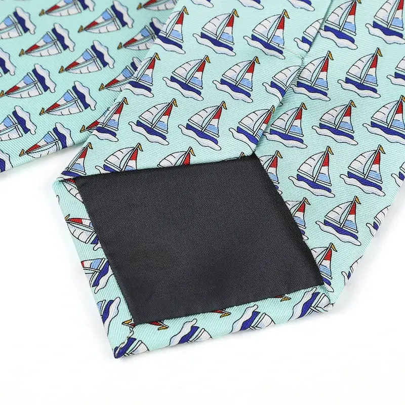 Reverse of a mint sailboat-pattern tie showing the seam and dark tipping.