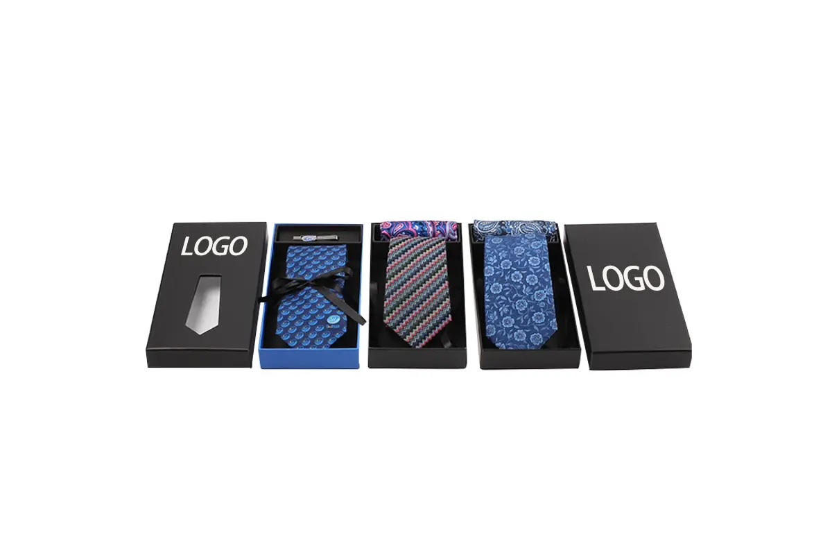 Three tie presentation boxes with sample logo placement on black lids.