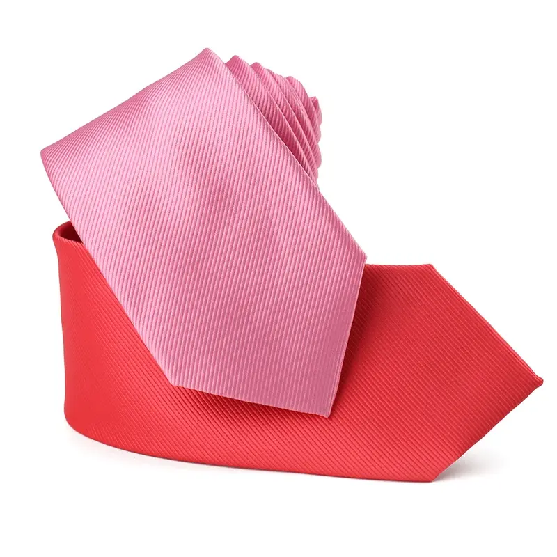 Pink and red rolled satin neckties on white background