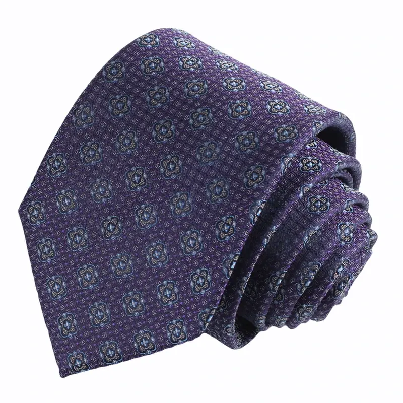 Rolled purple tie with small blue and green geometric motifs.