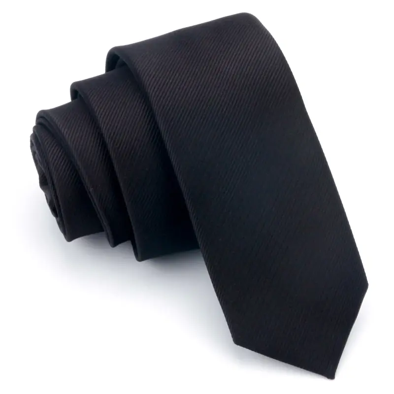 Rolled black necktie on white background