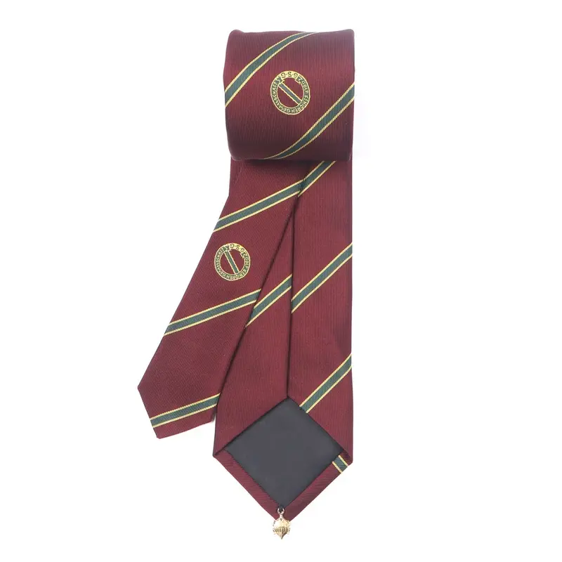 Burgundy tie with green and gold diagonal stripes and repeated circular emblems.