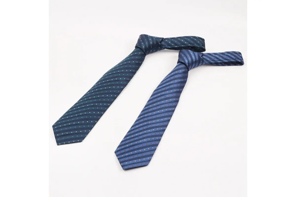 Two knotted blue ties showing their front blades and fine diagonal patterns.