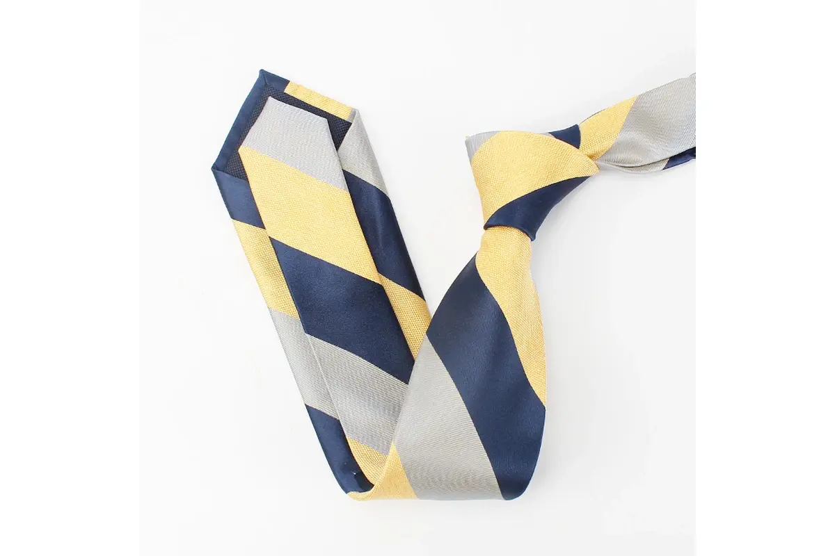 Yellow, cream and navy striped tie showing the knot, blade and reverse tip.