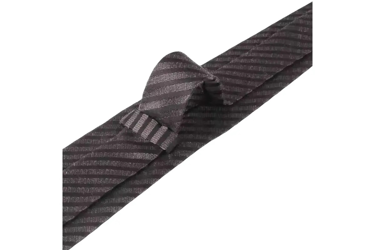 a dark tie with fine diagonal texture and striped keeper loop.