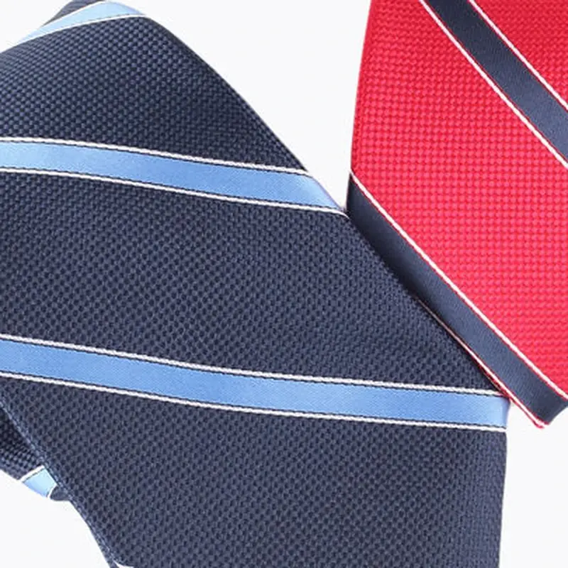 Close-up of navy and red striped neckties