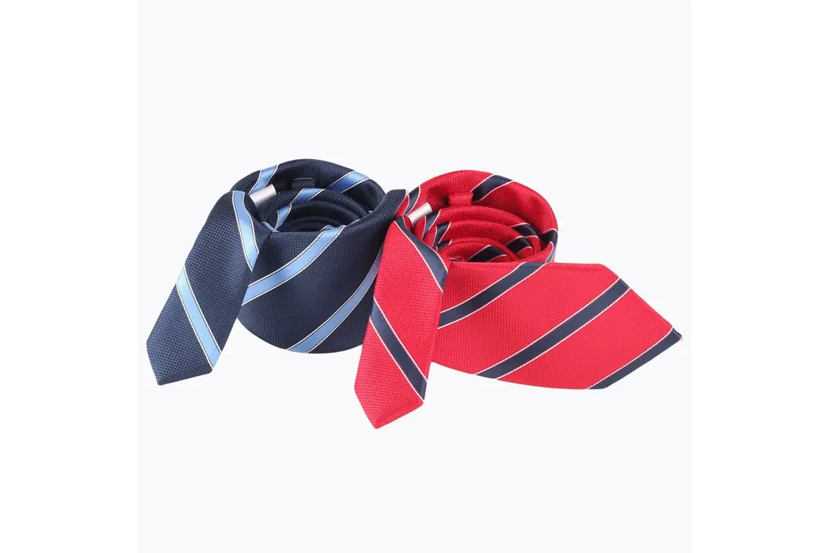Rolled navy and red ties with matching diagonal stripe arrangements.