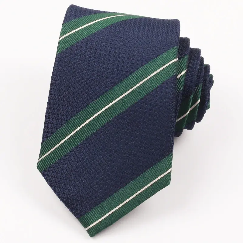 Rolled navy tie with green diagonal bands edged by thin pale lines.