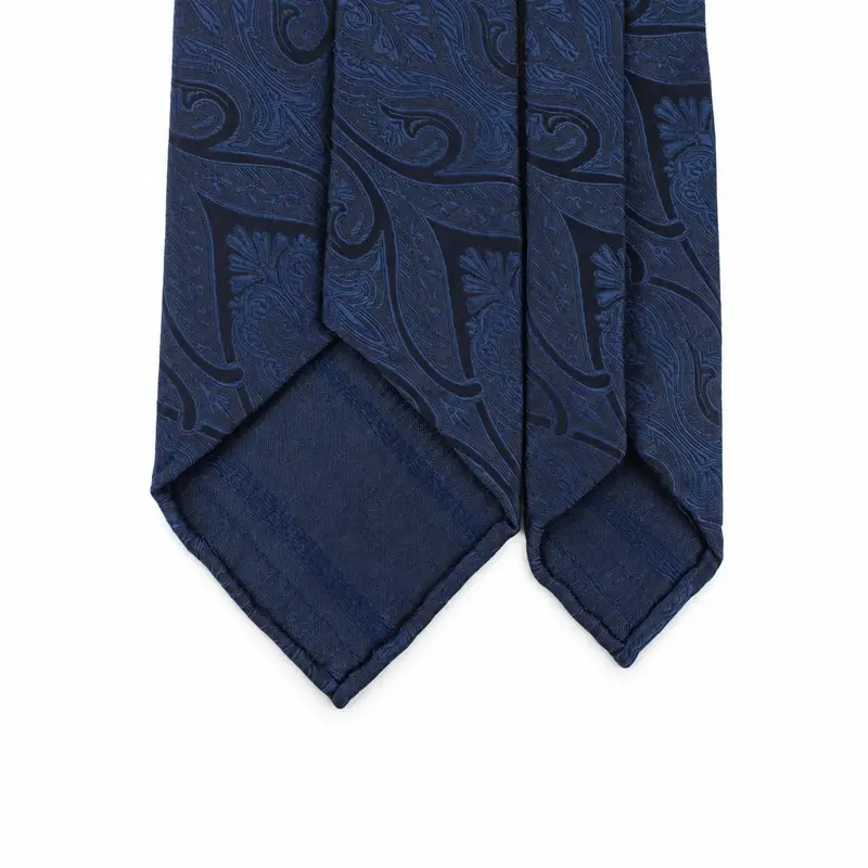 Reverse view of navy paisley silk tie blades showing the back finishing.
