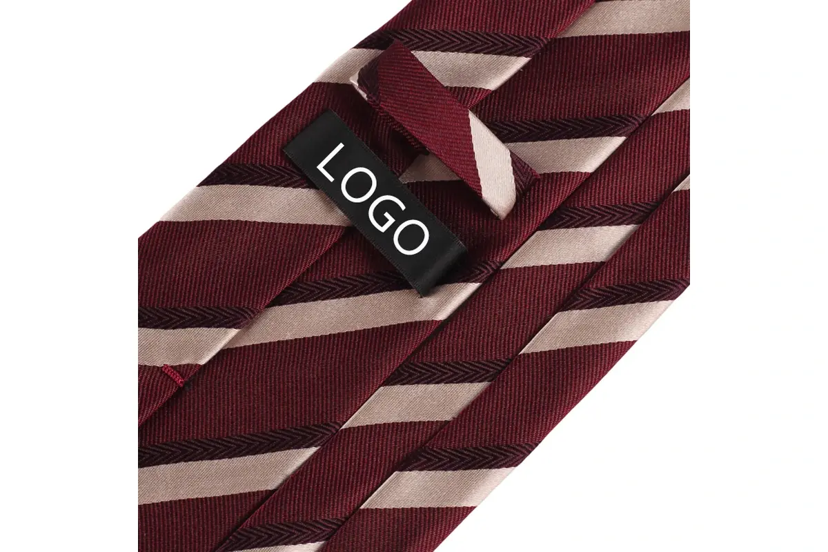 Sample logo label on the reverse of a burgundy and ivory striped tie.