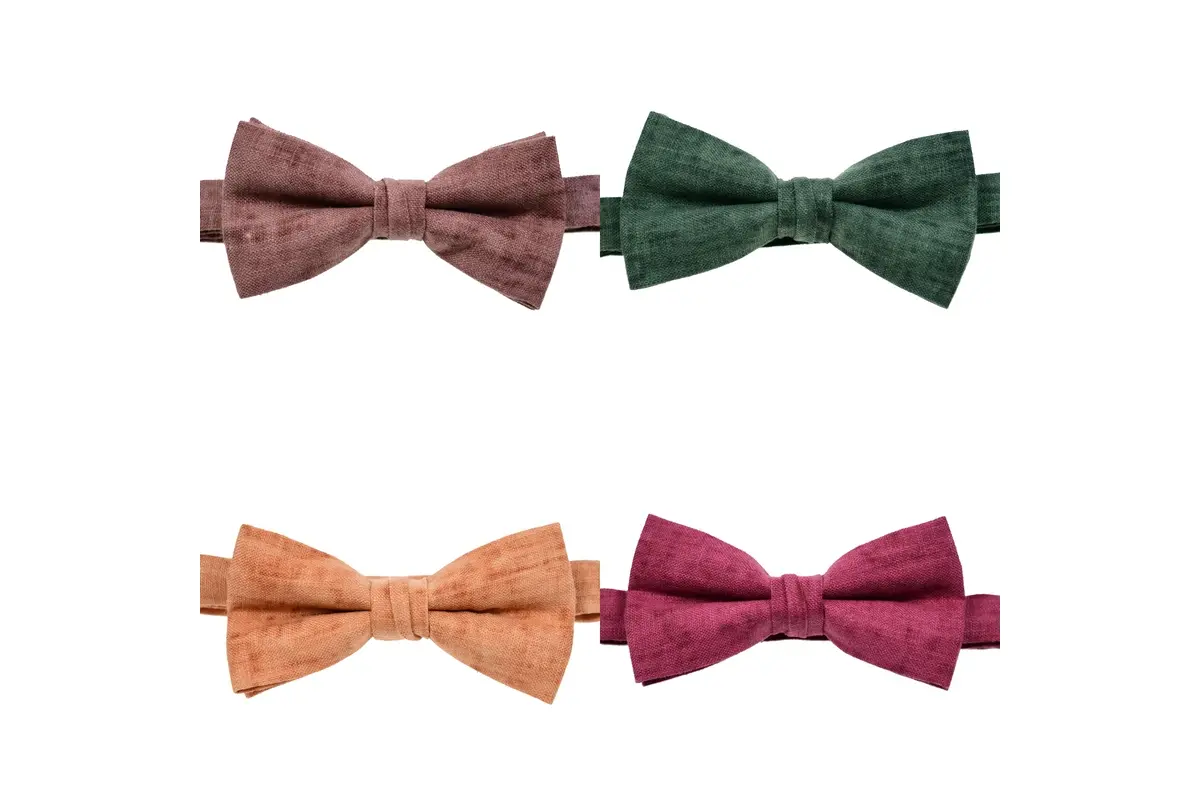 Four pre-tied bow ties in brown, green, orange and burgundy.