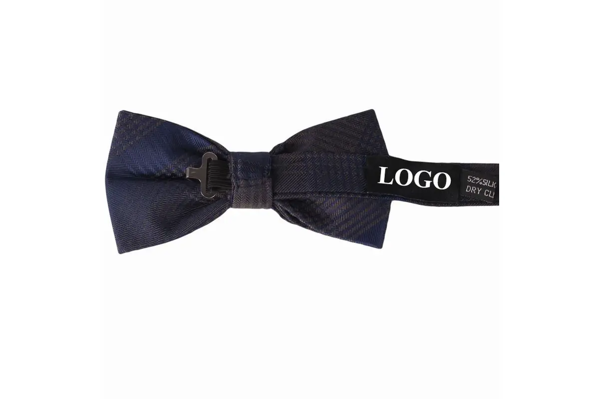 Navy bow tie reverse showing its clasp, adjustable strap and sample LOGO label.