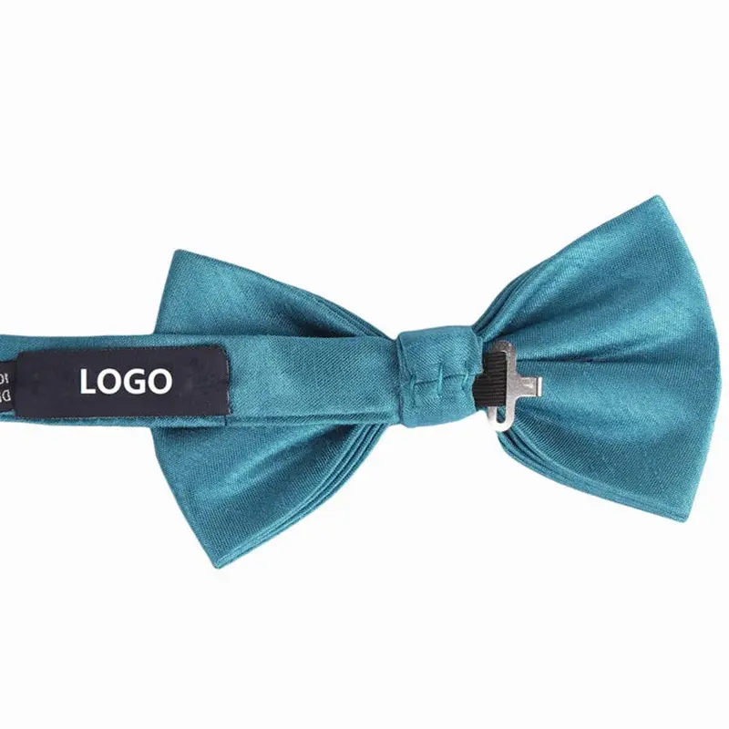 Teal bow tie reverse with an adjustable strap, clasp and sample LOGO label.