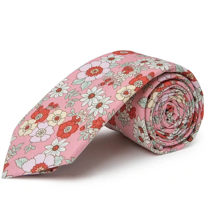Rolled pale pink tie with a multicolor floral pattern.