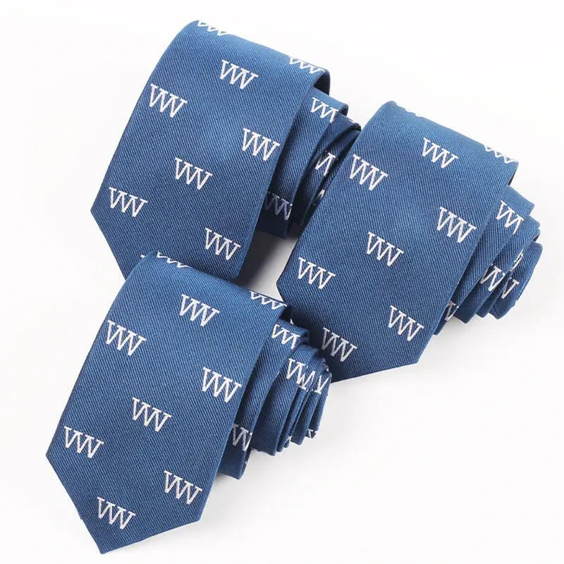 Blue ties with repeated white woven letter motifs.