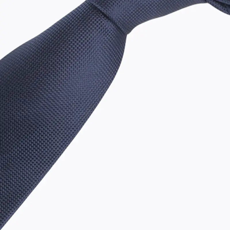 Close-up of navy necktie tied in a knot