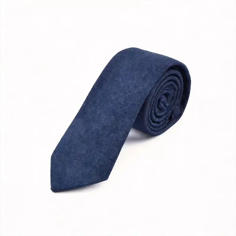 Rolled navy tie with a subtle tonal surface pattern.