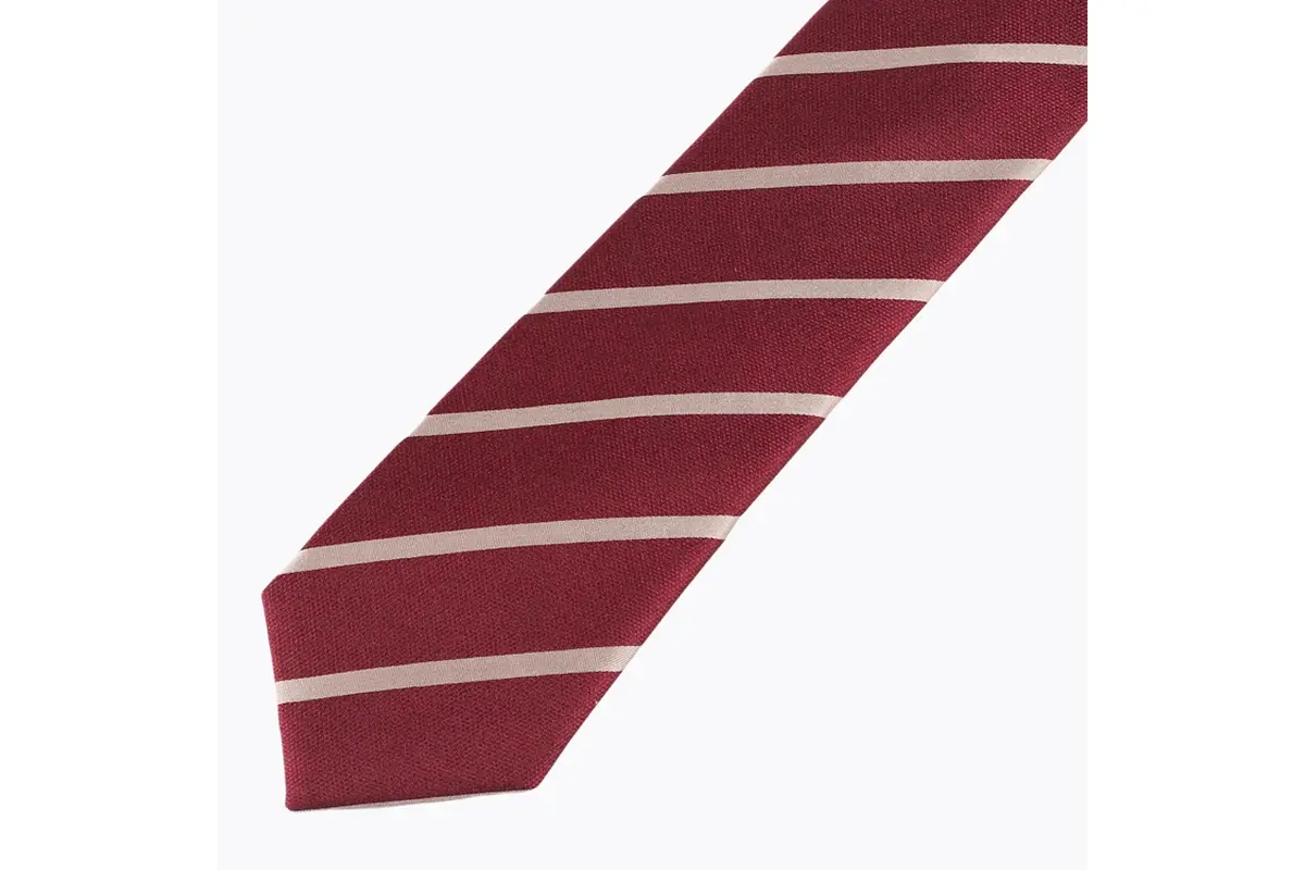 Burgundy tie blade with pale diagonal stripes and visible fine fabric texture.