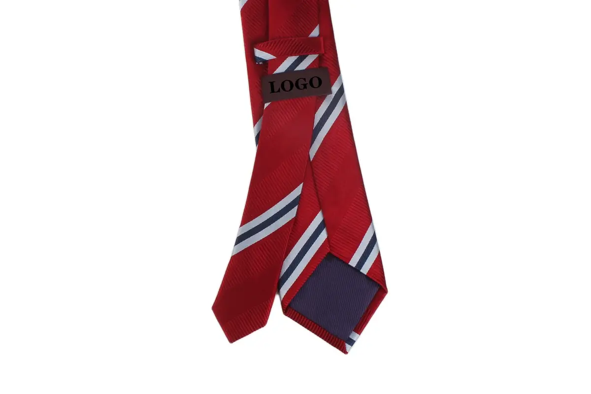 Red striped tie reverse with a sample label, keeper loop and navy tipping.