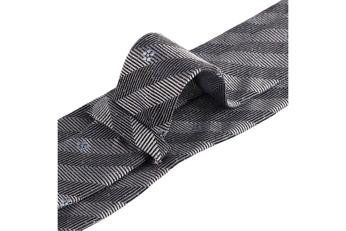 Grey tie reverse with herringbone texture, tonal stripe bands and keeper loop.