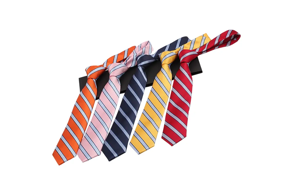Five knotted striped ties in orange, pink, navy, yellow and red colors.